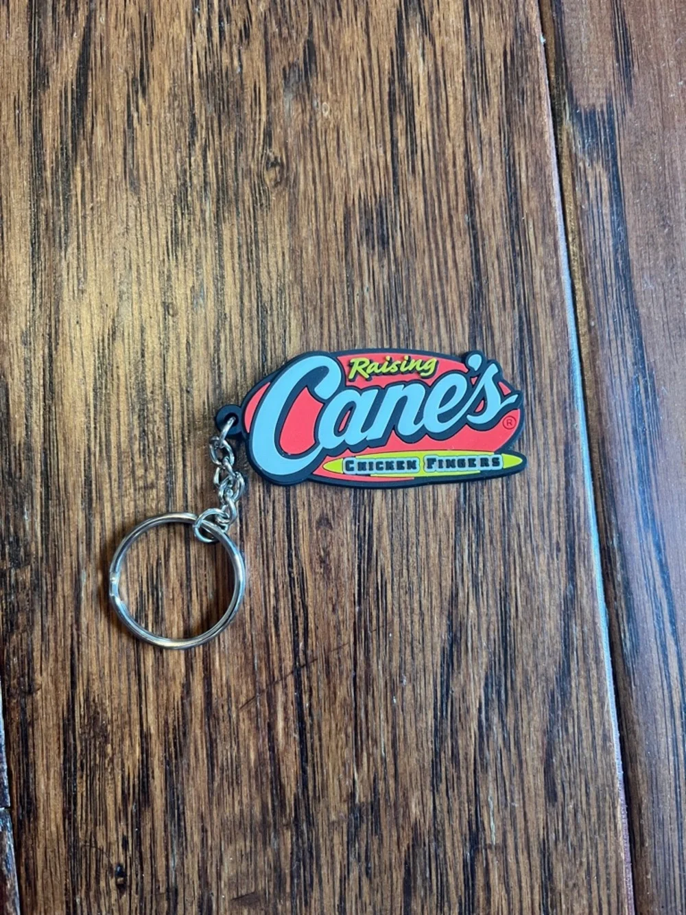 Hot Topic Raising Cane's Logo Keychain - Red, Blue, Yellow, Black